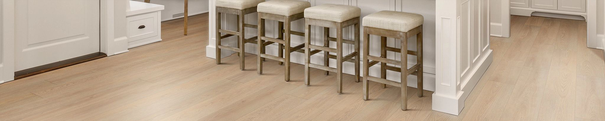 four bar stools at an island in kitchen from Deloreto Flooring Inc in Winter Park