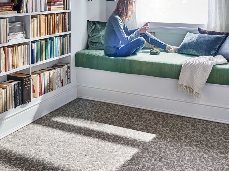 reading in bed having a nice view from window on Winter Park, FL area by Deloreto Flooring Inc